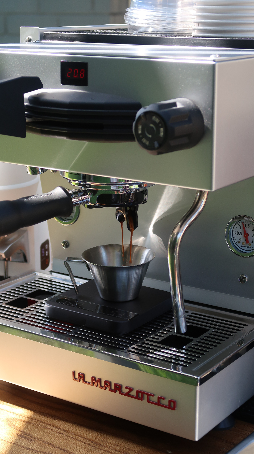Barista pulling an espresso shot for a corporate office coffee catering event